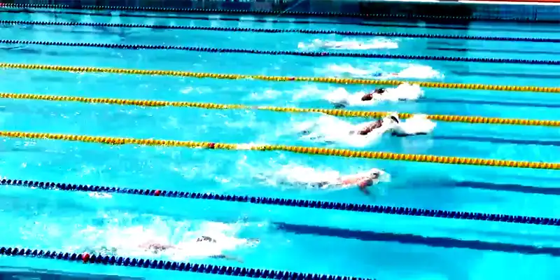 A six-lane race with swimmers in every lane